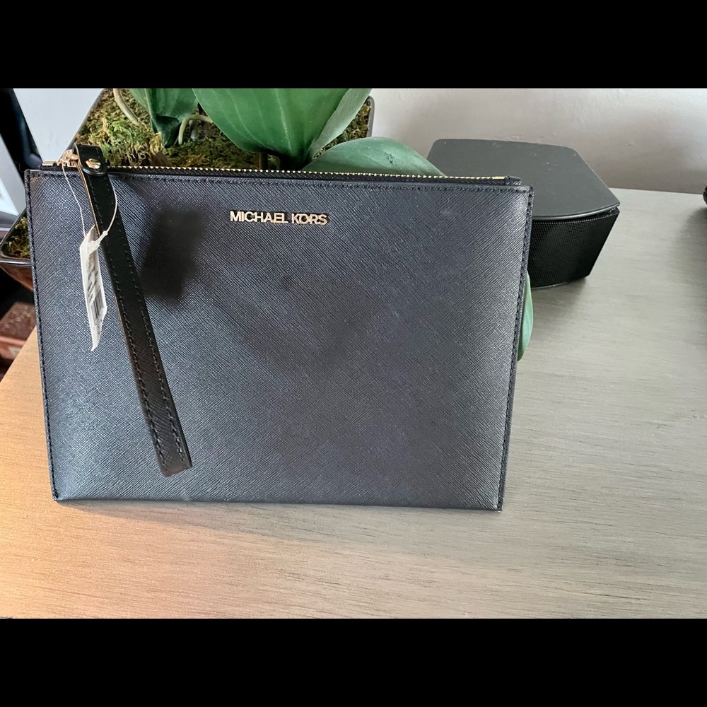 Michael Kors medium size wristlet. NWT.